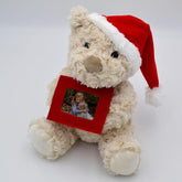 Personalised Christmas Teddy Bear with a red felt photo frame which has a photo of 2 children printed in it.
